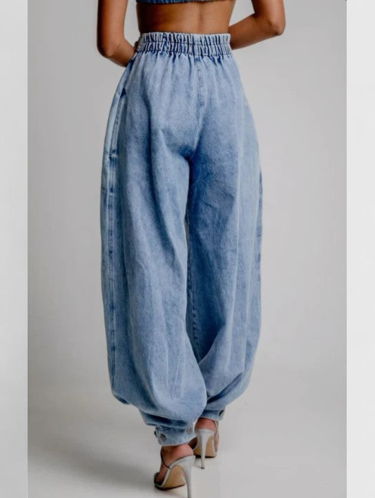 Pantaloni a gamba larga da donna con gonna plissettata